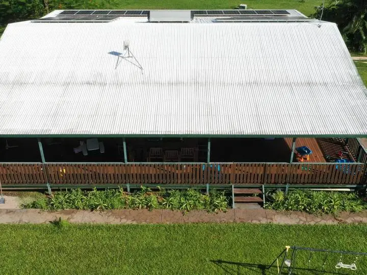 An aerial view of a Territory house with a freshly cleaned metal roof