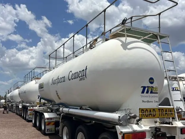 A line of washed tanker trailers parked up at the yard, paintwork and tanks back to clean