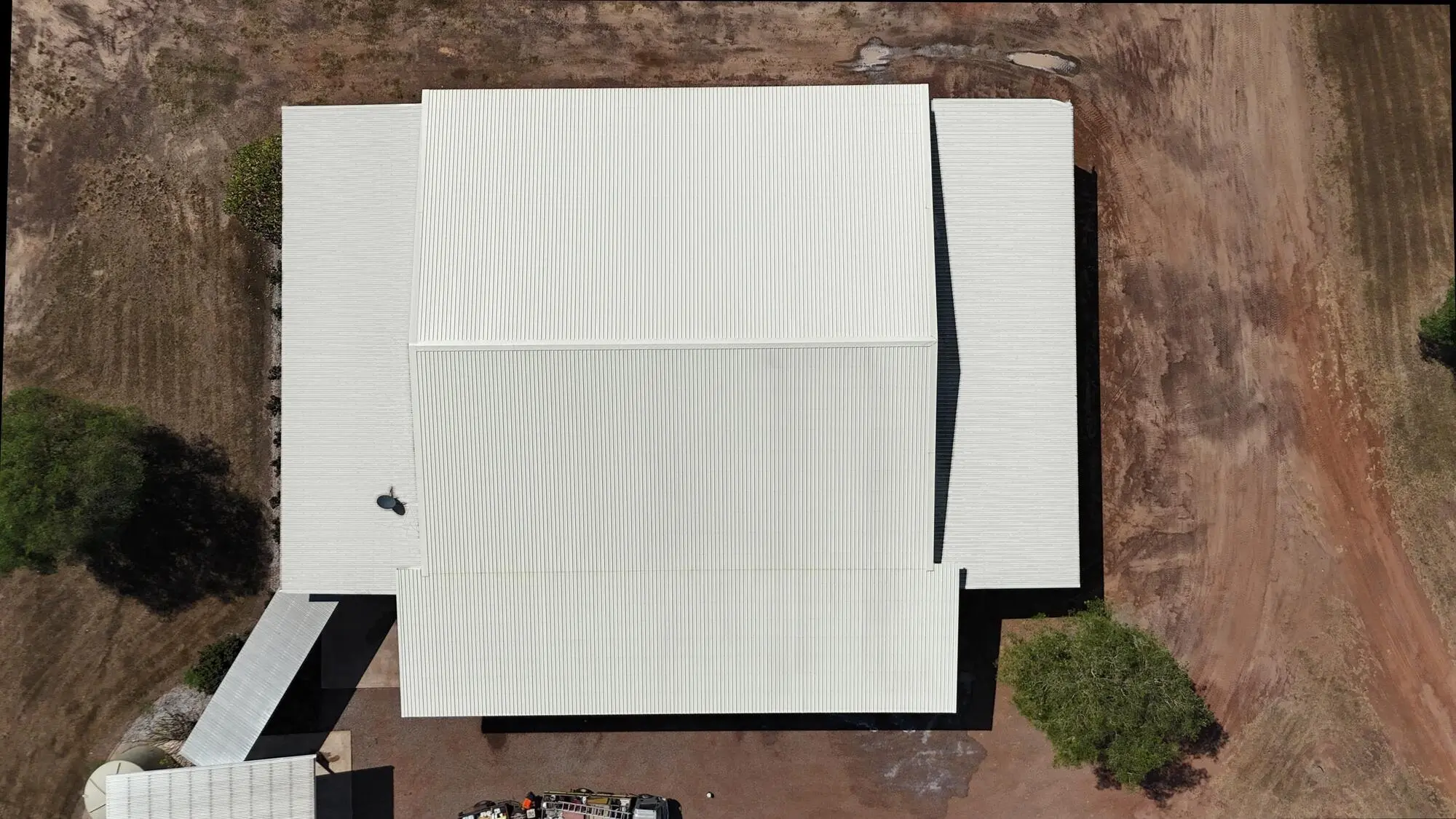 The same roof finished, every section of sheeting back to clean cream Colorbond