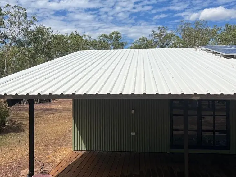 A Territory home with a clean metal roof and verandah after a house wash