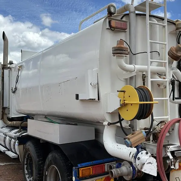 A water truck on the wash pad, hose reel and tank cleaned down